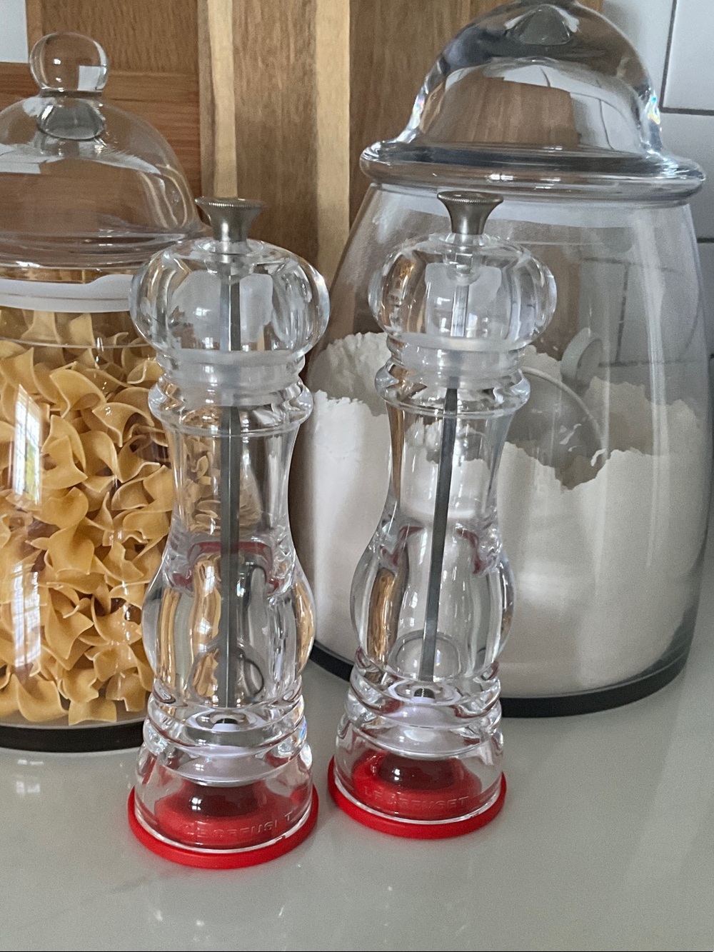 Le Creuset Clear Acrylic Salt and Pepper Mills with Red Bases